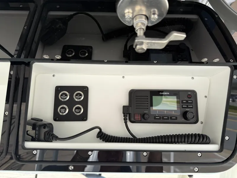 Slide: The Image of 2025 Key West 260 CC boat console with Garmin marine radio and control panel. - 28