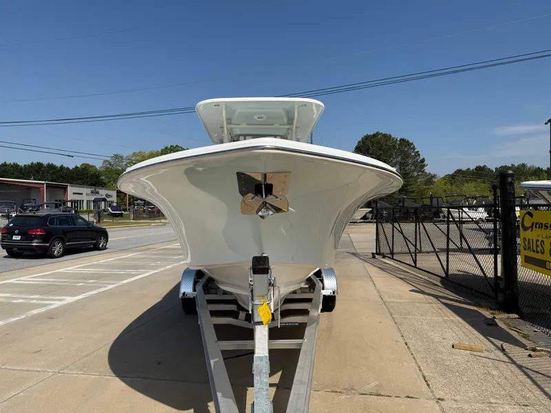 Slide: The Image of 2025 Key West 260 CC boat on trailer, parked outdoors under clear sky. - 3
