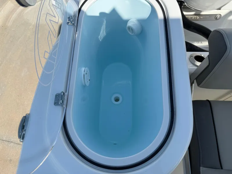 Slide: The Image of Livewell on 2025 Key West 260 CC boat, open lid, blue interior. - 37