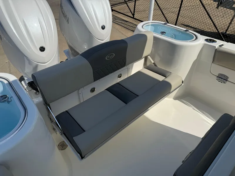 Slide: The Image of 2025 Key West 260 CC boat with cushioned seating and dual outboard motors. - 38