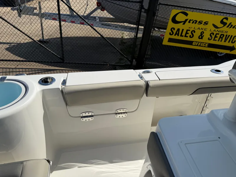 Slide: The Image of Key West 260 CC 2025 boat interior with seating and sales sign in background. - 39