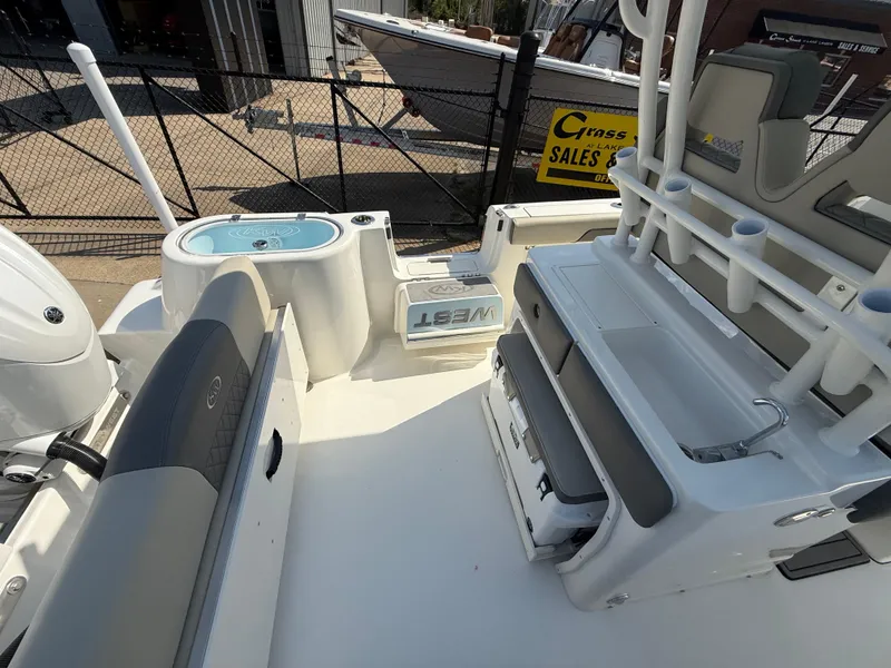 Slide: The Image of 2025 Key West 260 CC boat interior with seating and storage features. - 47