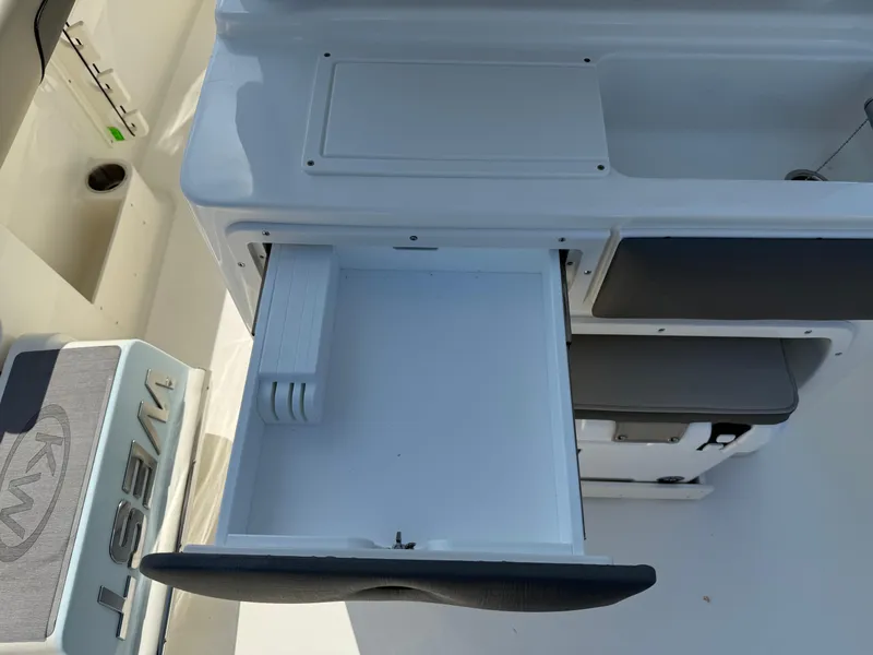 Slide: The Image of Open storage compartment on 2025 Key West 260 CC boat, showcasing sleek design and functionality. - 49