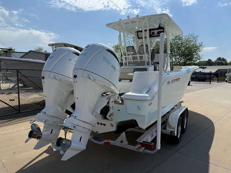 Slide: The Image of 2025 Key West 260 CC boat with dual outboard engines on a trailer. - 6