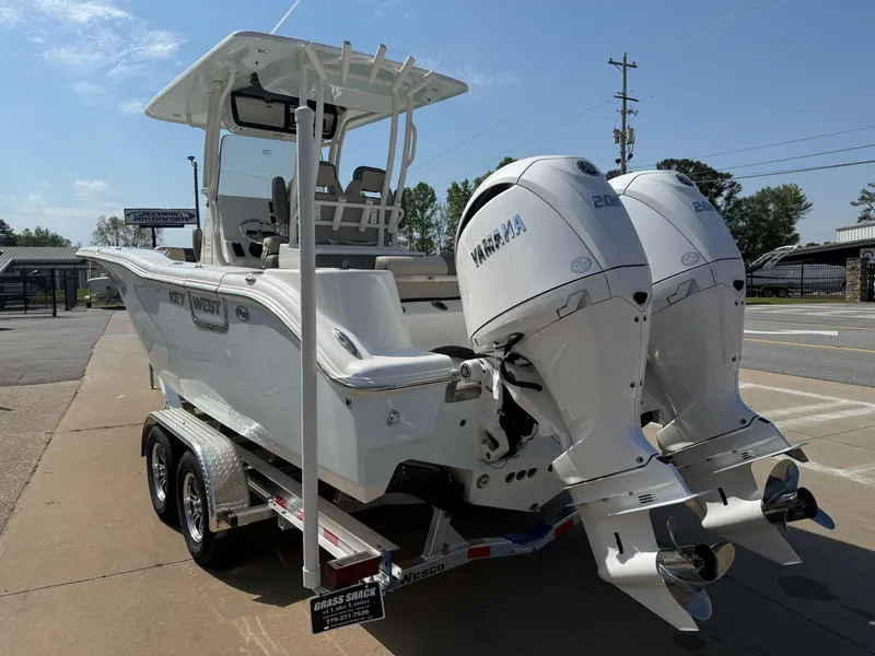 Slide: The Image of 2025 Key West 260 CC boat with dual Yamaha engines on a trailer. - 7