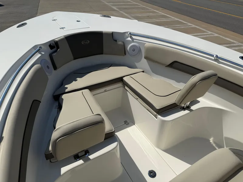 Slide: The Image of 2025 Key West 260 CC boat interior with cushioned seating and sleek design. - 8