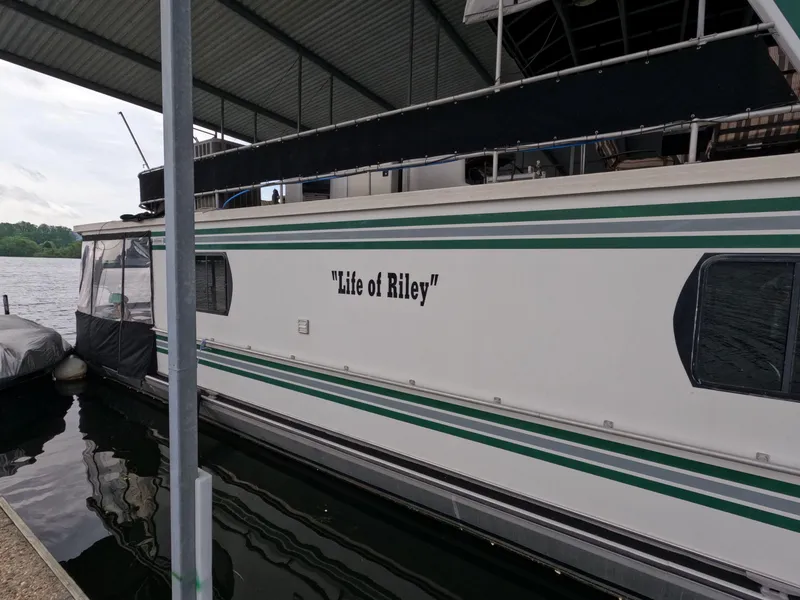 Slide: The Image of 1998 Jamestowner 1667WB Americana Custom houseboat named "Life of Riley" docked at marina. - 13