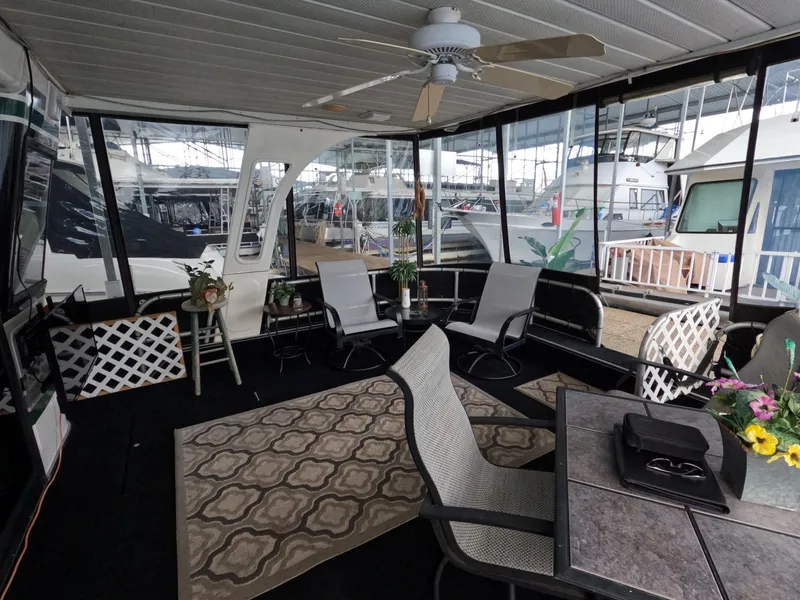 Slide: The Image of Interior of 1998 Jamestowner 1667WB Americana Custom houseboat with seating and decor. - 21