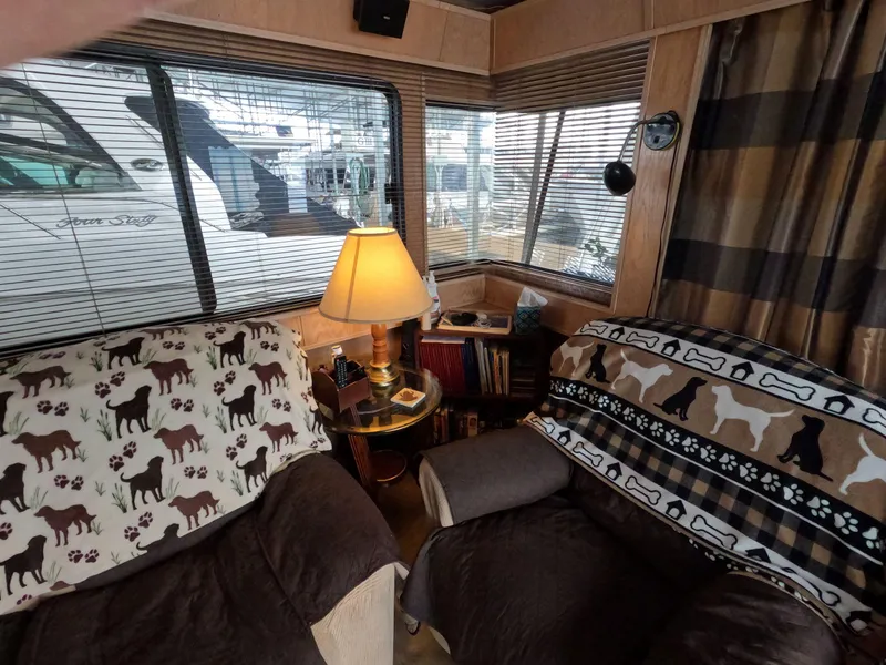 Slide: The Image of Cozy 1998 Jamestowner 1667WB Americana Custom interior with dog-themed decor and warm lighting. - 30