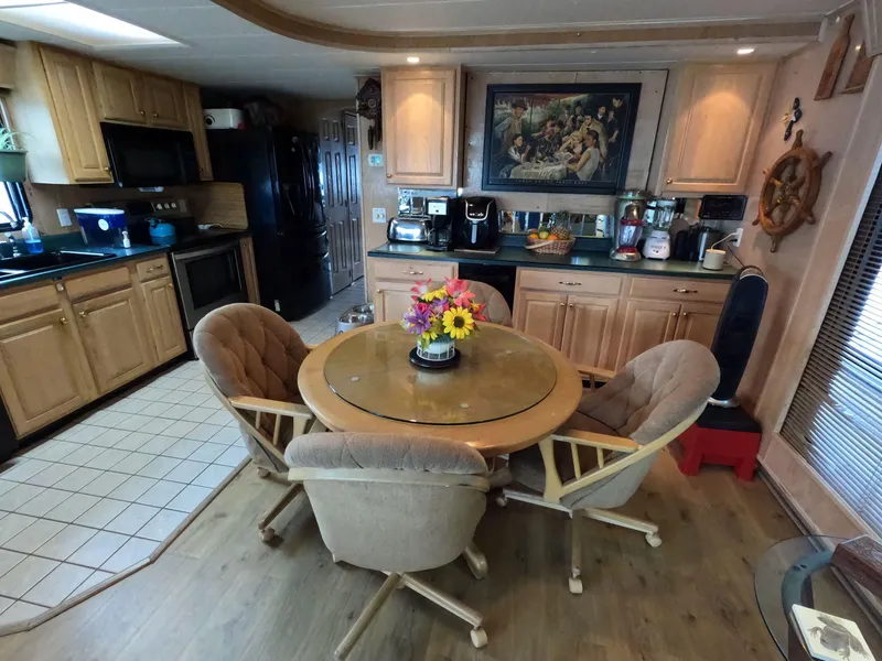 Slide: The Image of Cozy kitchen in 1998 Jamestowner 1667WB Americana Custom with round table and floral centerpiece. - 35