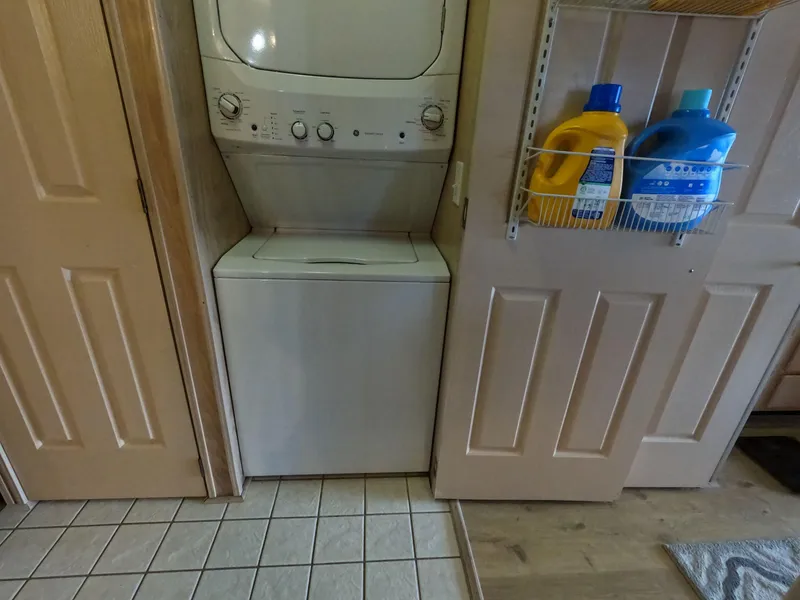 Slide: The Image of Stacked washer and dryer in a 1998 Jamestowner 1667WB Americana Custom laundry area. - 44