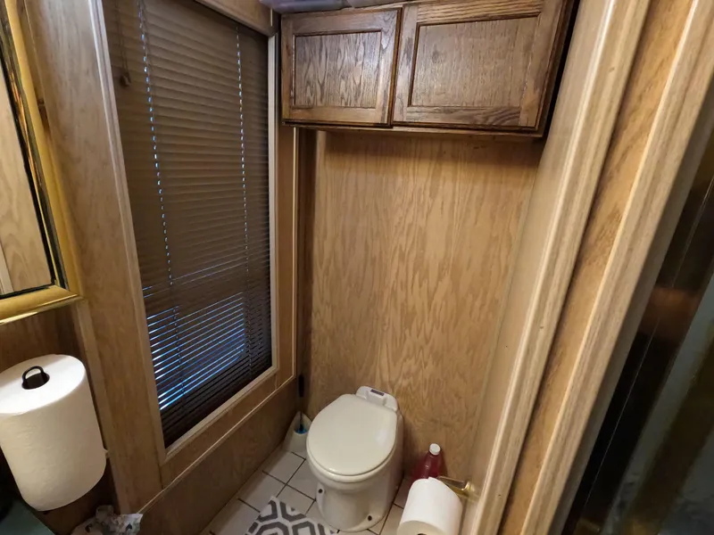 Slide: The Image of Bathroom in 1998 Jamestowner 1667WB Americana Custom with wooden cabinets and blinds. - 49