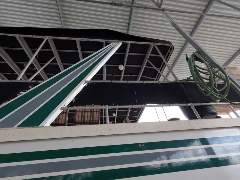 Slide: The Image of Houseboat under a metal roof, featuring green and white stripes, Jamestowner 1667WB Americana Custom, 1998. - 8