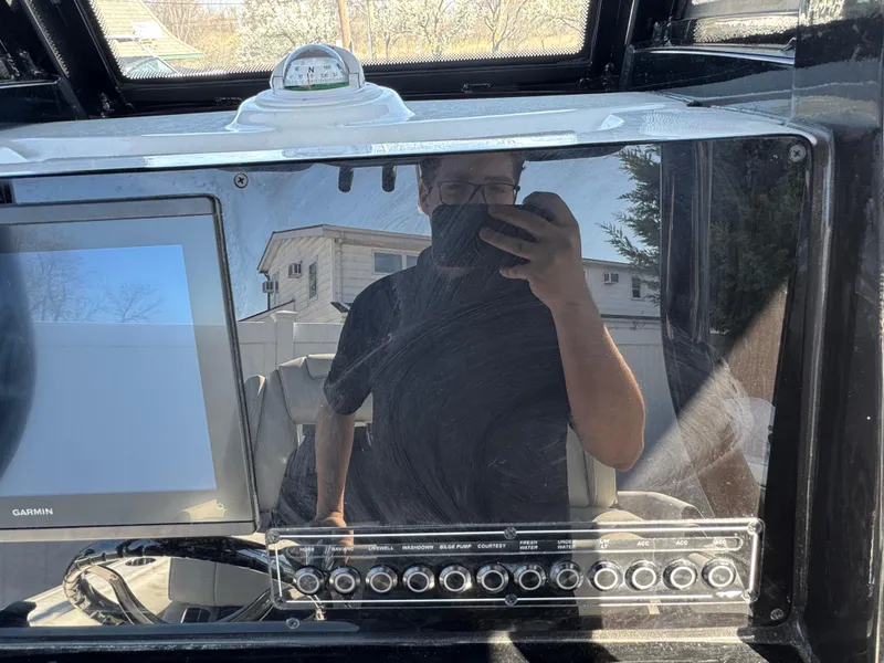 Slide: The Image of 2025 Tidewater 232 LXF dashboard with Garmin display and control panel. - 11