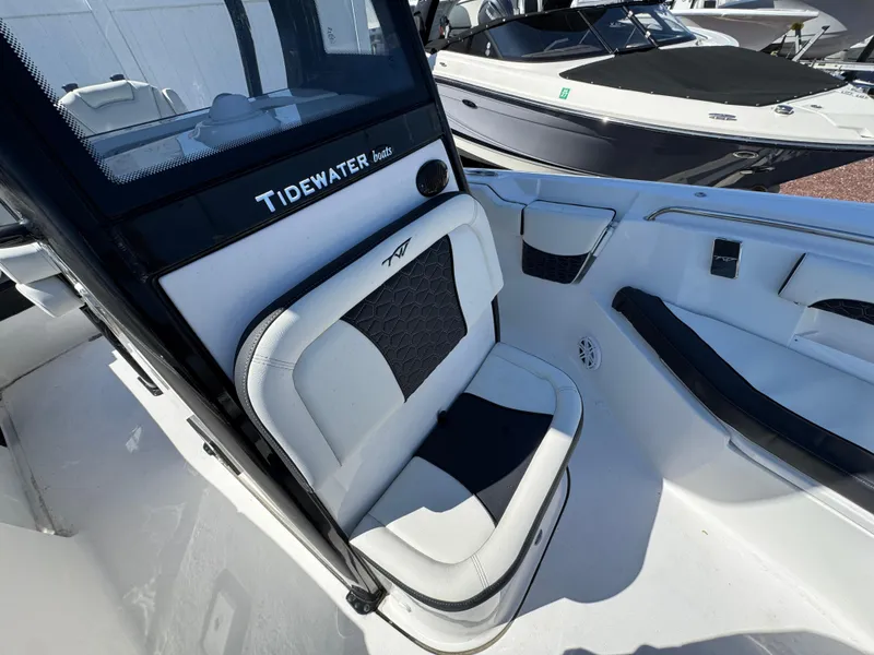Slide: The Image of 2025 Tidewater 232 LXF boat interior with sleek seating and modern design. - 19