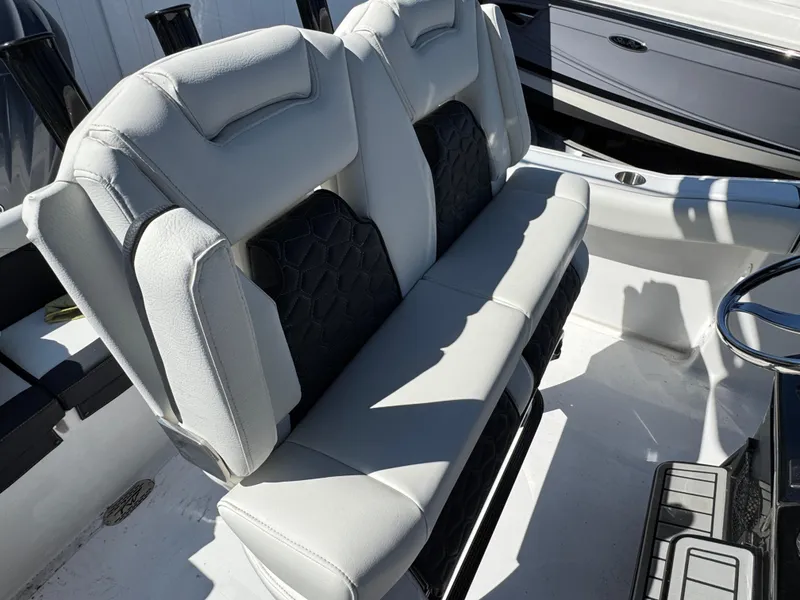 Slide: The Image of 2025 Tidewater 232 LXF boat interior with luxurious seating and modern design. - 9