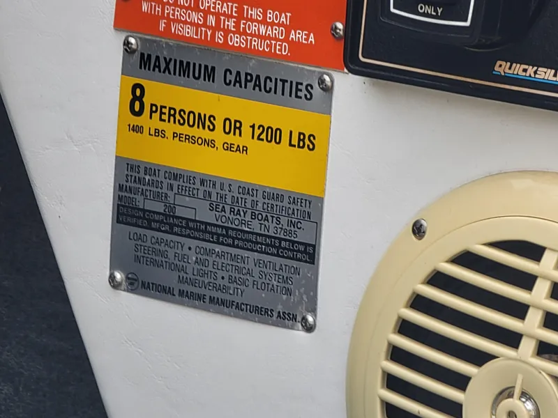 Slide: The Image of 1990 Sea Ray 200 BR capacity label, maximum 8 persons or 1200 lbs, compliance details visible. - 17