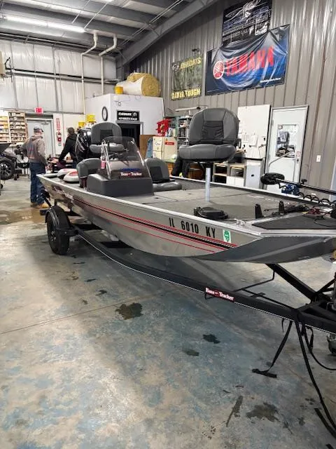 Slide: The Image of 2019 Bass Tracker Classic boat in a showroom, featuring dual seats and a sleek design. - 3