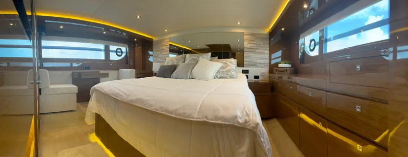Slide: The Image of Luxurious bedroom interior of 2021 Cruisers Yachts 60 Cantius with modern design and ambient lighting. - 10