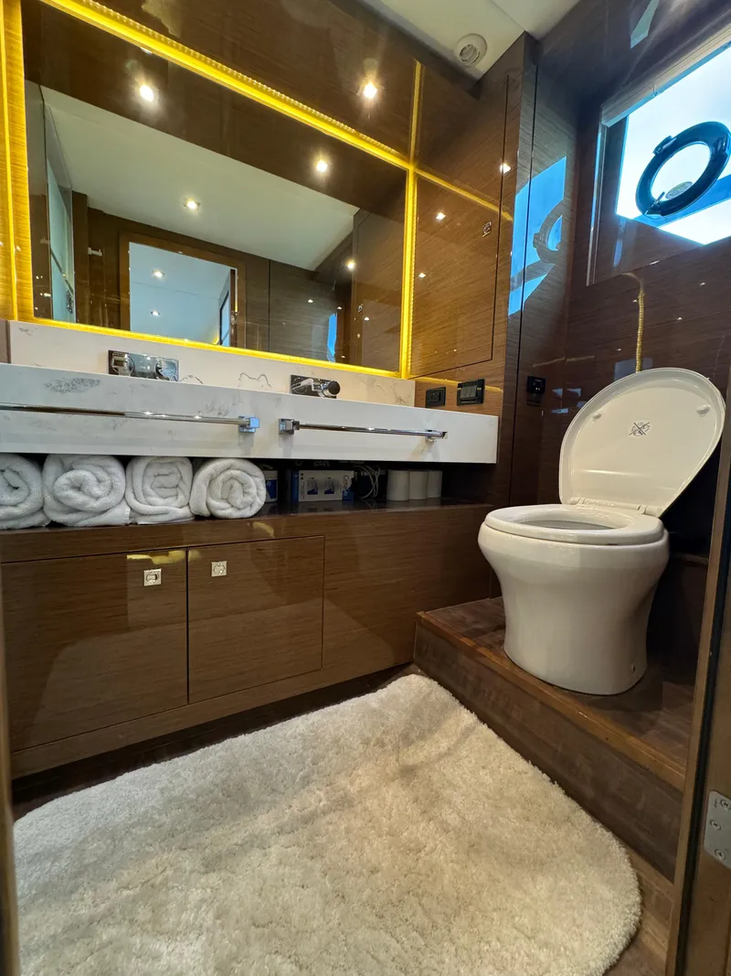 Slide: The Image of Luxurious bathroom in 2021 Cruisers Yachts 60 Cantius with modern fixtures and elegant design. - 12