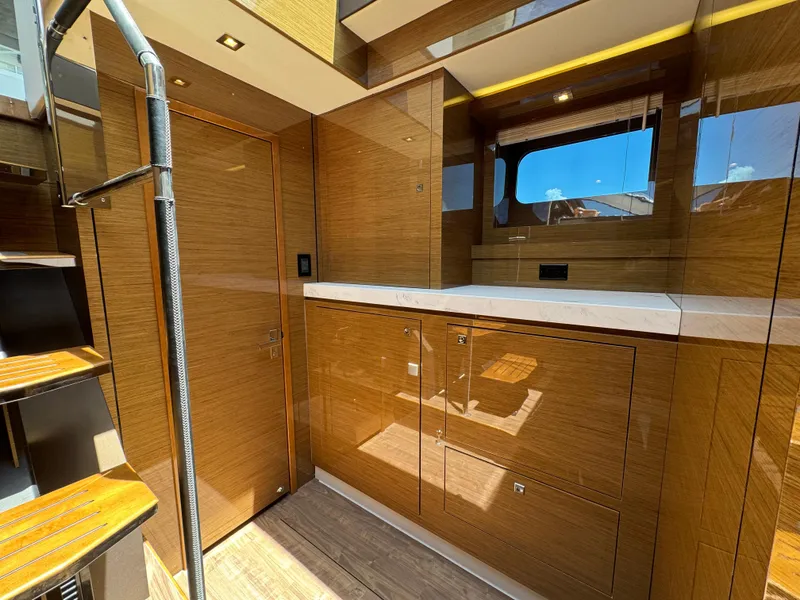 Slide: The Image of Luxurious interior of 2021 Cruisers Yachts 60 Cantius with wood finish and modern design. - 14