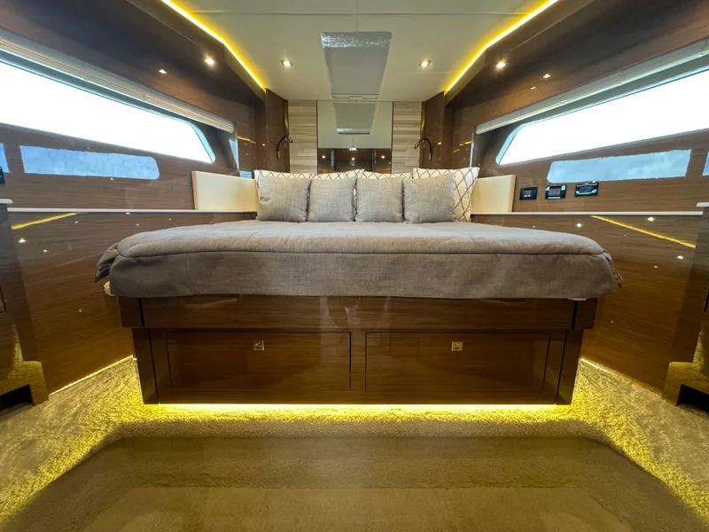 Slide: The Image of Luxurious bedroom interior of 2021 Cruisers Yachts 60 Cantius with modern lighting and wood finish. - 16