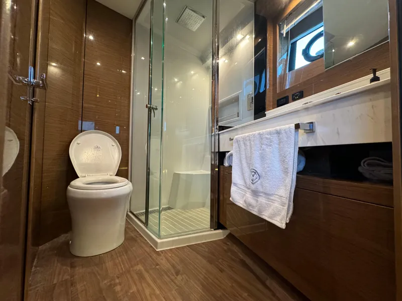Slide: The Image of Luxurious bathroom in 2021 Cruisers Yachts 60 Cantius, featuring modern fixtures and elegant design. - 17