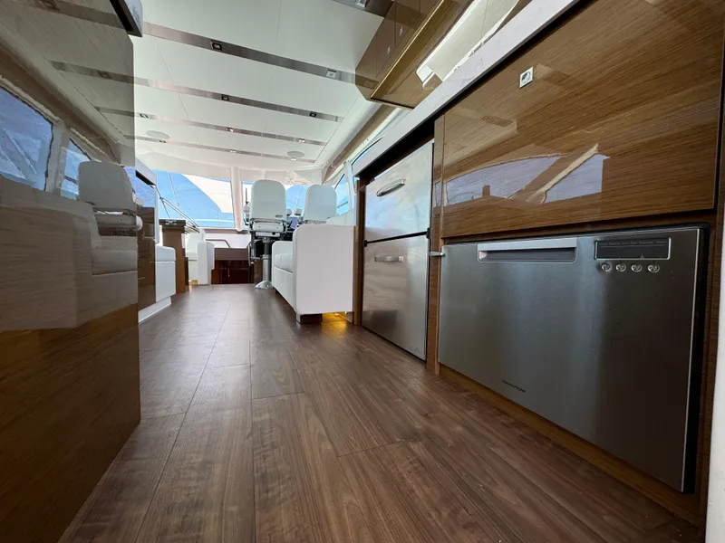Slide: The Image of Luxurious interior of 2021 Cruisers Yachts 60 Cantius with modern kitchen appliances. - 29