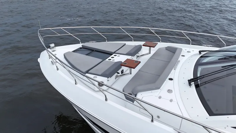 Slide: The Image of 2021 Cruisers Yachts 60 Cantius with spacious deck and seating on the water. - 45