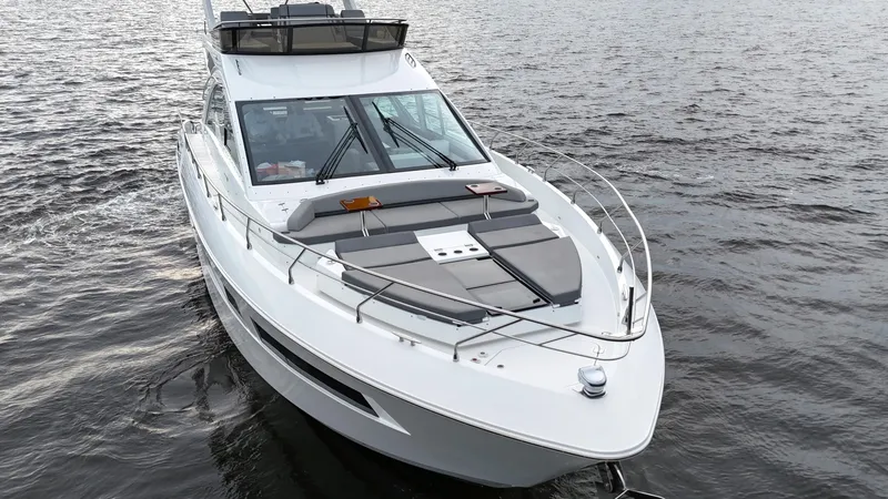 Slide: The Image of 2021 Cruisers Yachts 60 Cantius on water, showcasing sleek design and luxury features. - 49
