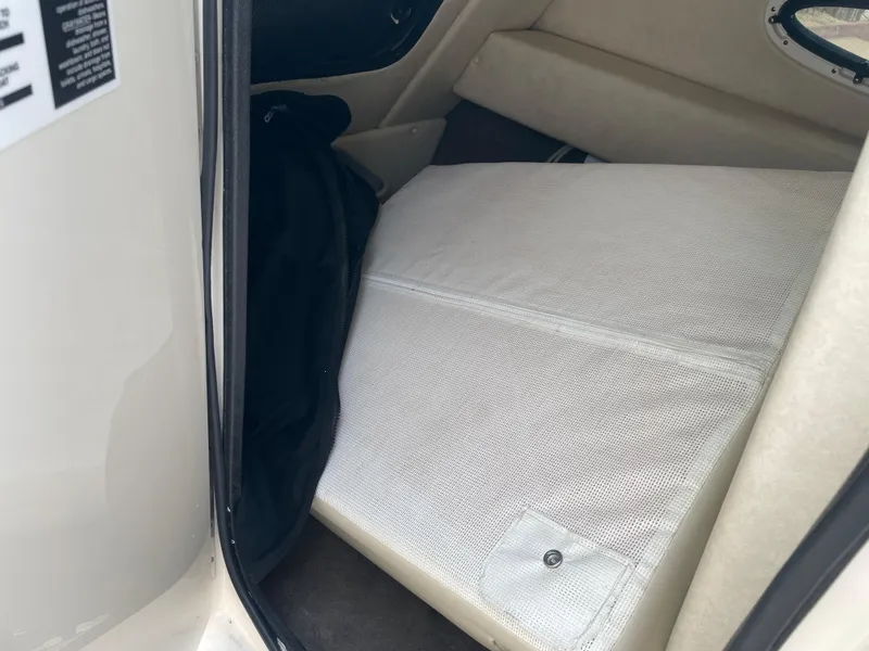 Slide: The Image of 2009 Sea Ray 260 Sundeck interior storage compartment with cushioned seating. - 18