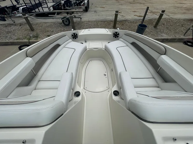 Slide: The Image of 2009 Sea Ray 260 Sundeck boat with spacious white seating and cup holders. - 21