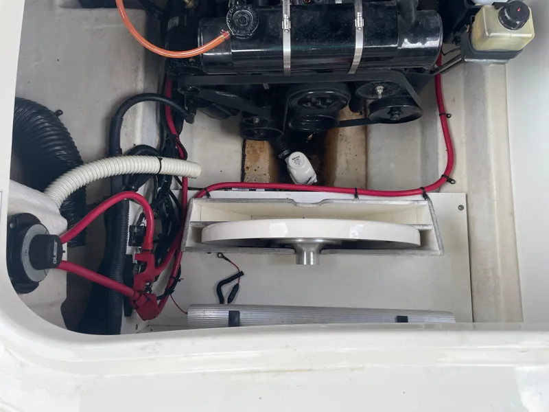 Slide: The Image of Engine compartment of a 2009 Sea Ray 260 Sundeck with visible wiring and components. - 29