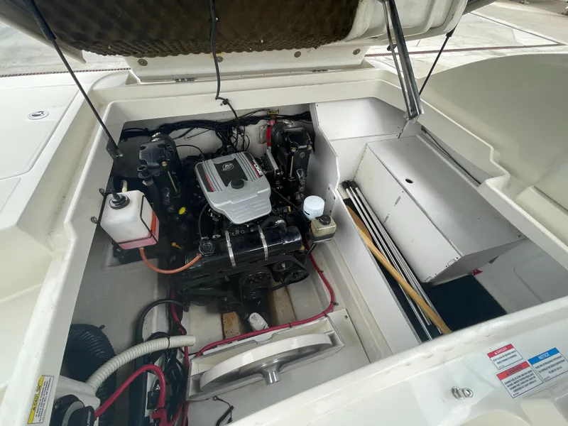 Slide: The Image of Engine compartment of a 2009 Sea Ray 260 Sundeck boat, showcasing the motor and components. - 30