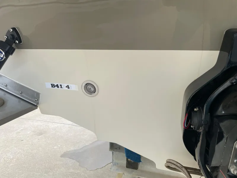 Slide: The Image of 2009 Sea Ray 260 Sundeck boat hull with visible engine components and identification label. - 32