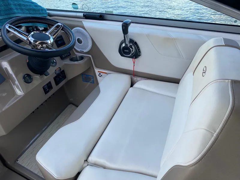 Slide: The Image of 2019 Regal 26 Express boat interior with steering wheel and control panel. - 8