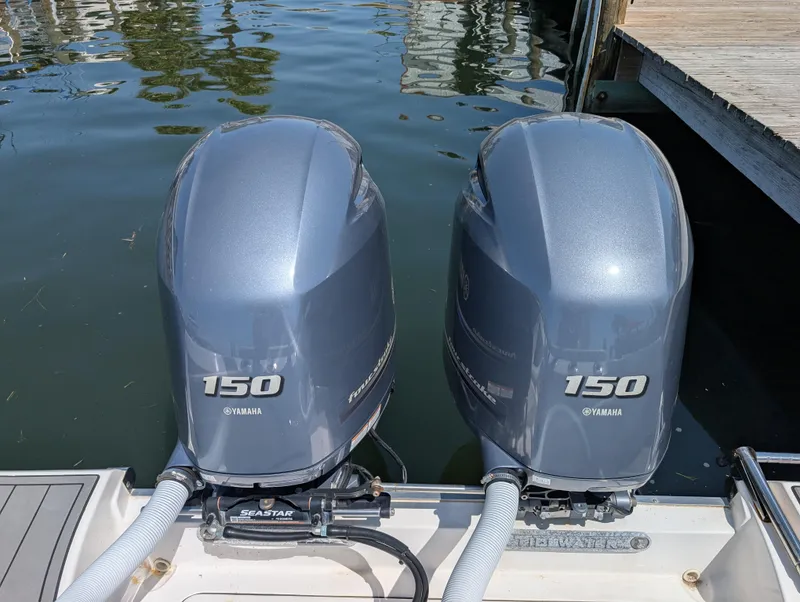 Slide: The Image of Twin Yamaha 150 outboard motors on a 2022 Tidewater 256 CC Adventure boat. - 19