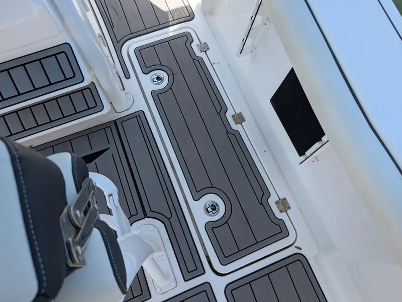 Slide: The Image of 2022 Tidewater 256 CC Adventure boat deck with sleek, modern design and durable flooring. - 31