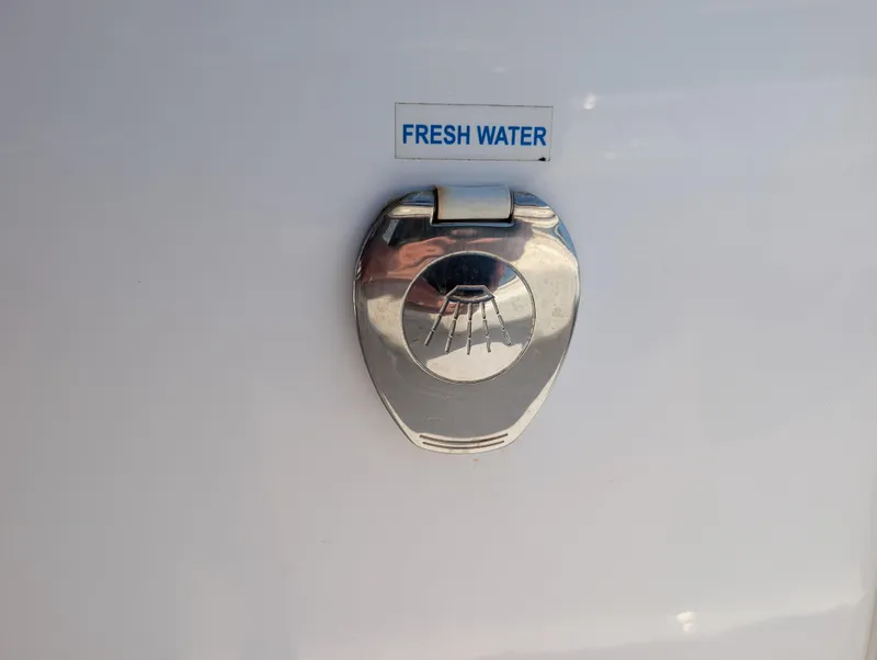 Slide: The Image of Fresh water access on 2022 Tidewater 256 CC Adventure boat. - 32