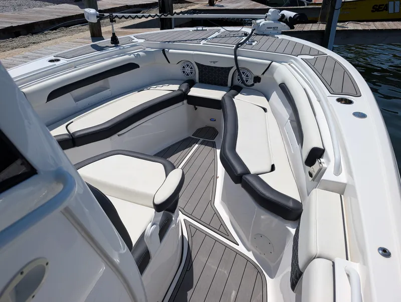 Slide: The Image of 2022 Tidewater 256 CC Adventure boat interior with sleek seating and modern design. - 33