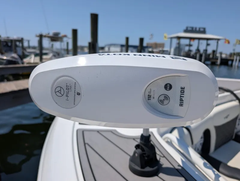 Slide: The Image of Tidewater 256 CC Adventure 2022 boat with Riptide i-Pilot trolling motor at marina. - 34