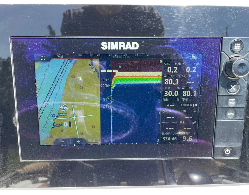 Slide: The Image of Simrad navigation display on 2017 Sportsman Masters 207 Bay Boat, showing map and sonar data. - 14