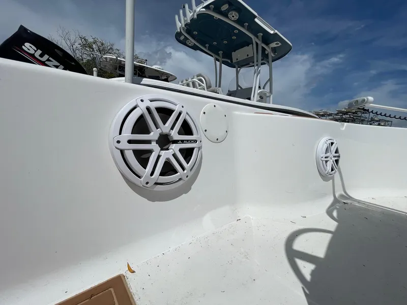 Slide: The Image of 2017 Sportsman Masters 207 Bay Boat with speakers and blue sky background. - 18