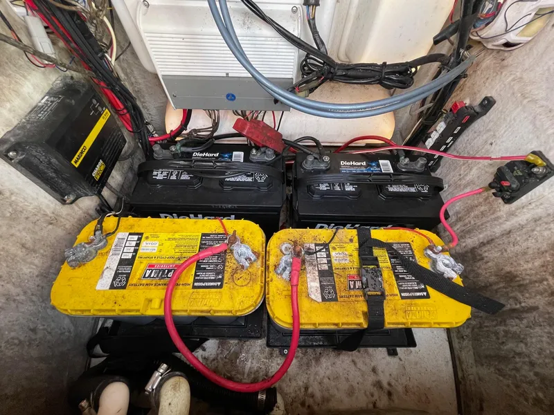Slide: The Image of Batteries and wiring inside a 2017 Sportsman Masters 207 Bay Boat. - 25