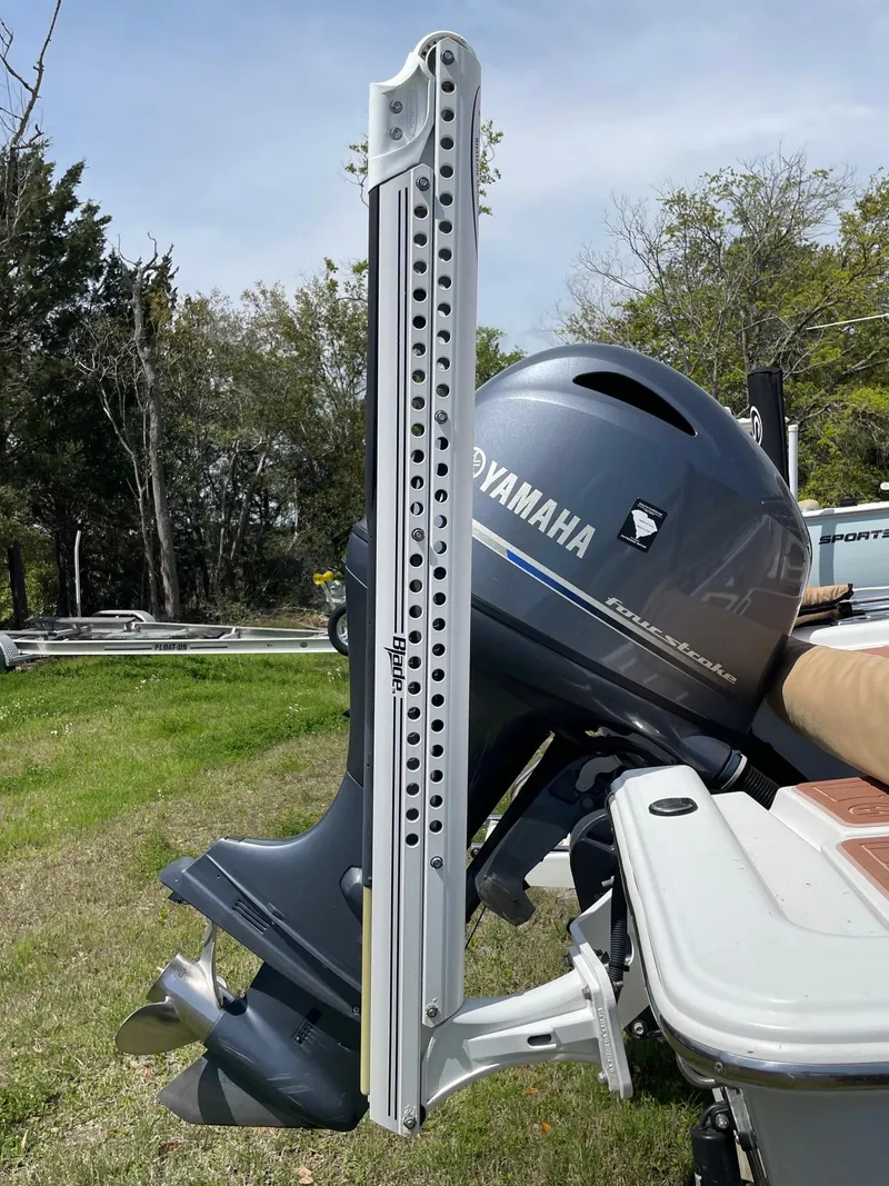 Slide: The Image of 2017 Sportsman Masters 207 Bay Boat with Yamaha outboard motor, parked on grass. - 28