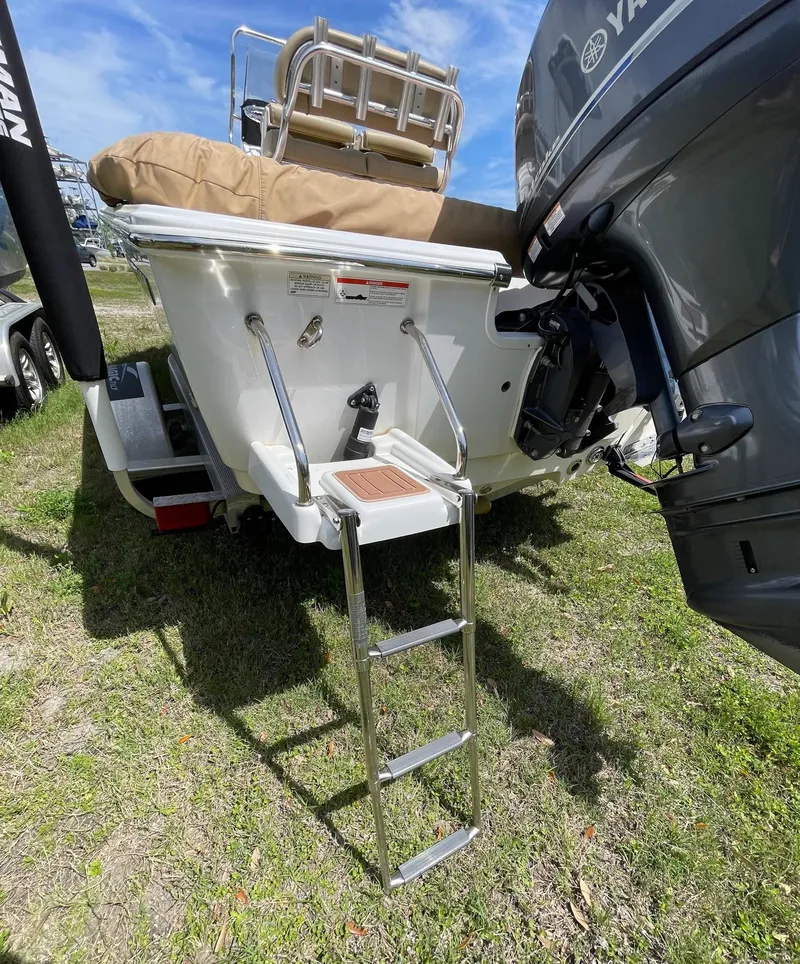 Slide: The Image of 2017 Sportsman Masters 207 Bay Boat with ladder and Yamaha motor on grass. - 29