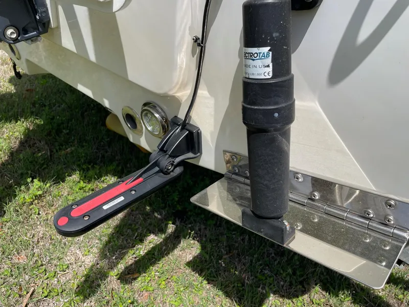 Slide: The Image of 2017 Sportsman Masters 207 Bay Boat trim tab and sensor detail on grass. - 30