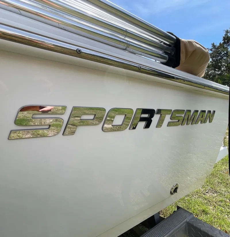 Slide: The Image of 2017 Sportsman Masters 207 Bay Boat side view with logo in sunlight. - 31