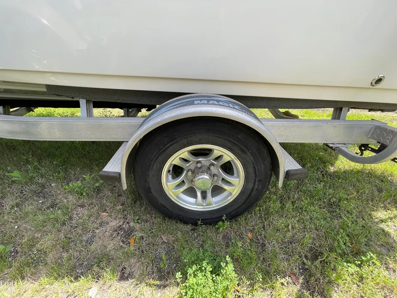 Slide: The Image of Trailer wheel of a 2017 Sportsman Masters 207 Bay Boat on grass. - 39