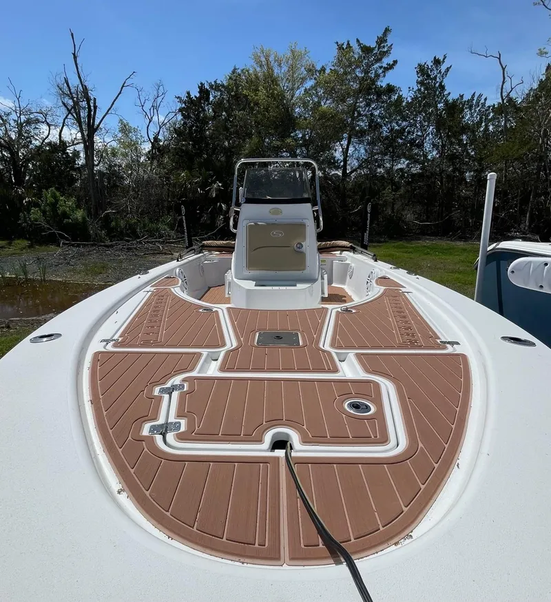 Slide: The Image of 2017 Sportsman Masters 207 Bay Boat with brown deck, parked outdoors. - 5
